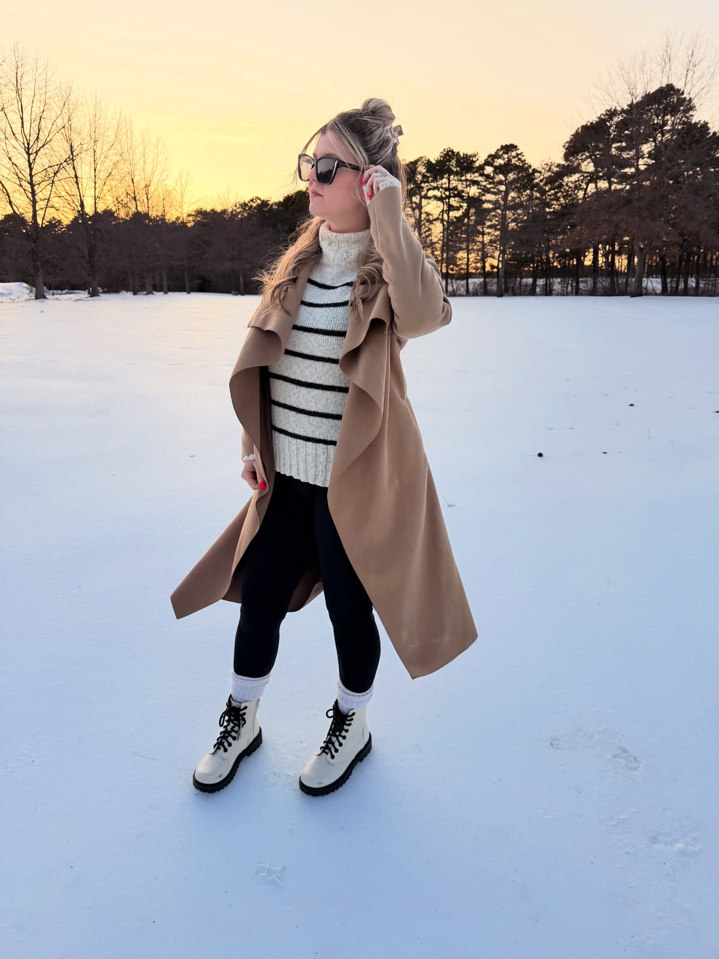 A Camel Coat with a Striped Sweater for Snowy Days